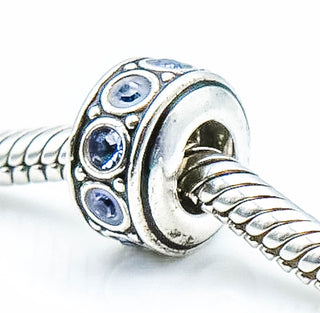 CHAMILIA Wheel December Birthstone Sterling Silver Charm With Light Blue Swarovski Crystals
