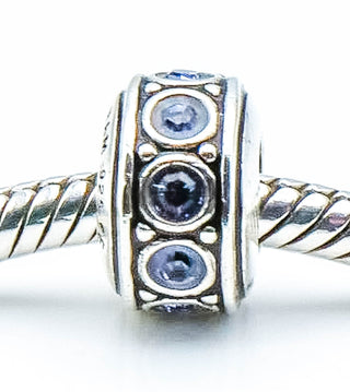 CHAMILIA Wheel December Birthstone Sterling Silver Charm With Light Blue Swarovski Crystals