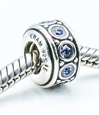 CHAMILIA Wheel December Birthstone Sterling Silver Charm With Light Blue Swarovski Crystals